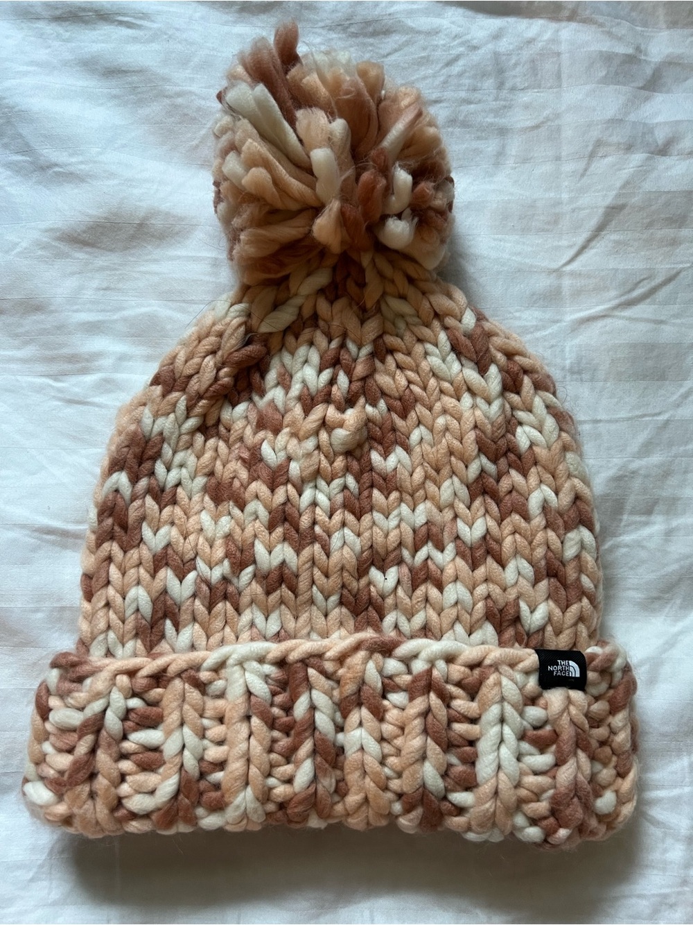 The North Face Nanny Pom Knit Beanie in Cream/Tan/Peach